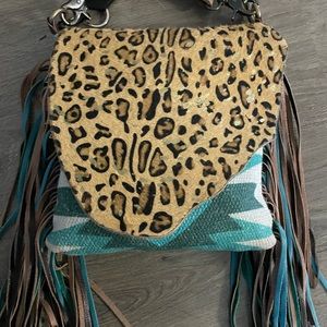 Western fringe cross body purse.